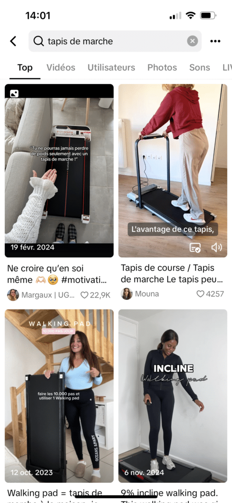 Exemple de recherche TikTok pour “tapis de marche” montrant plusieurs vidéos populaires, illustrant comment les utilisateurs se servent des réseaux sociaux comme moteurs de recherche pour découvrir des produits. 